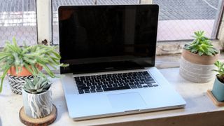macbook pro 2010 sitting on desk