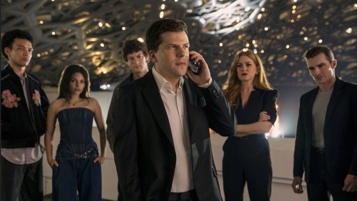Justice Smith, Ariana Greenblatt, Dominic Sessa, Jesse Eisenberg on the phone, Isla Fisher and Dave Franco in Now You See Me: Now You Don't