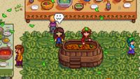 Stardew Valley - The farmer standing beside Marnie while they cook for the Luau