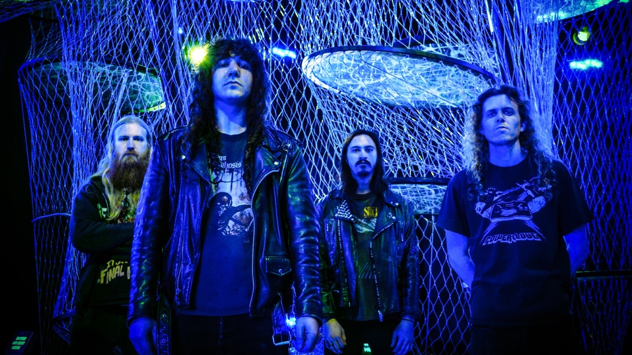 Metal band Vektor standing in a line in blue light