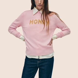 flay lay image of woman wearing pink jumper