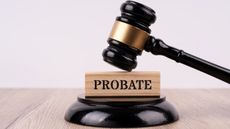 A gavel comes down on a block that says probate.
