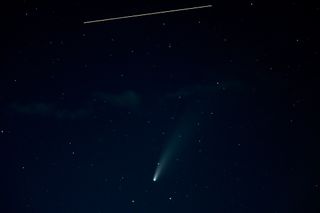 This striking photo showcases both comet NEOWISE and the International Space Station. This 10-second exposure image shows the space station's movement as a straight, yellow line and the comet as a diffuse, glowing object seemingly falling from the sky. Comet NEOWISE made its closest approach to Earth yesterday (July 23).