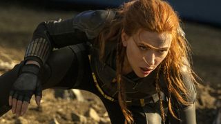 Scarlett Johansson kneels in a superhero pose in Black Widow