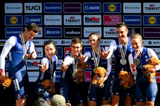 Audrey Cordon-Ragot (second left) and the French squad celebrate silver at the mixed relay team time trial at the 2023 UCI Road World Championships