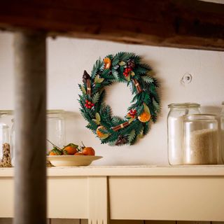 LECO Icons Wreath hanging on a kitchen wall