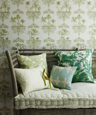 palm tree wallpaper with patterned cushions on bench