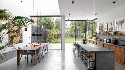 rear and side kitchen extension with two sets of sliding floors and poured concrete flooring