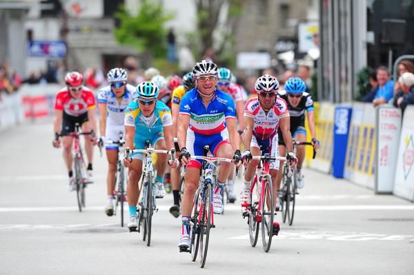 Thomas Voeckler (Europcar) leads the yellow jersey group to the line.