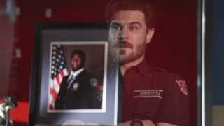 Jack Gibson sees his reflection looking at a photo of Dean Miller onStation 19
