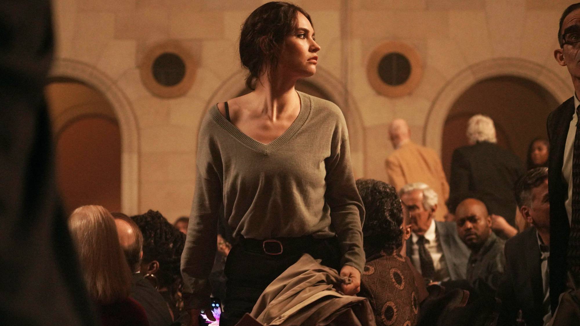 Lily James as Sarah Grant in "Relay"