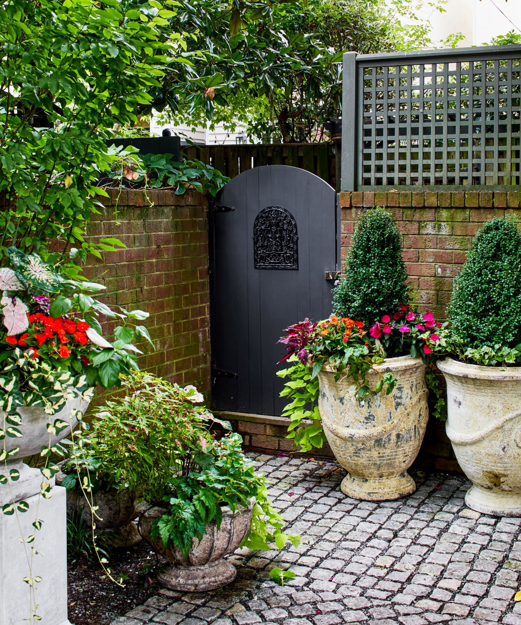 courtyard garden with weathered pots and urns for a vintage feel