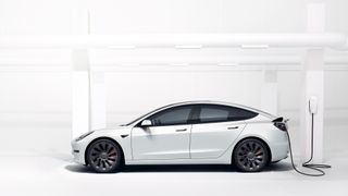 Tesla model 3 in white recharging