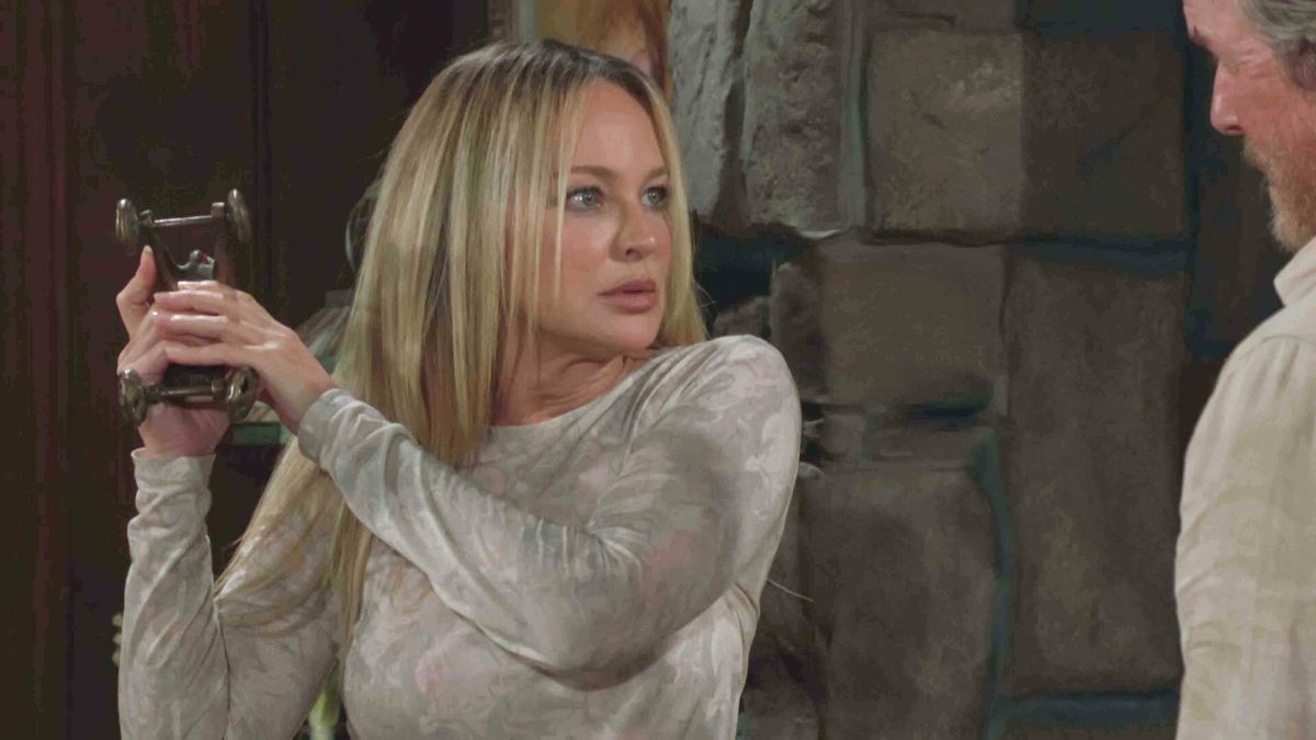 Sharon Case as Sharon afraid and holding something as a weapon in The Young and the Restless