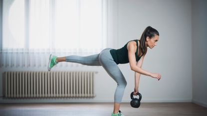 Woman performing single-leg Romanian deadlifts