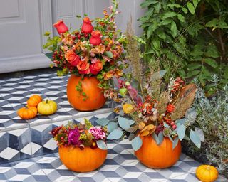 bloom & wild halloween bouquets in carved pumpkins on door step