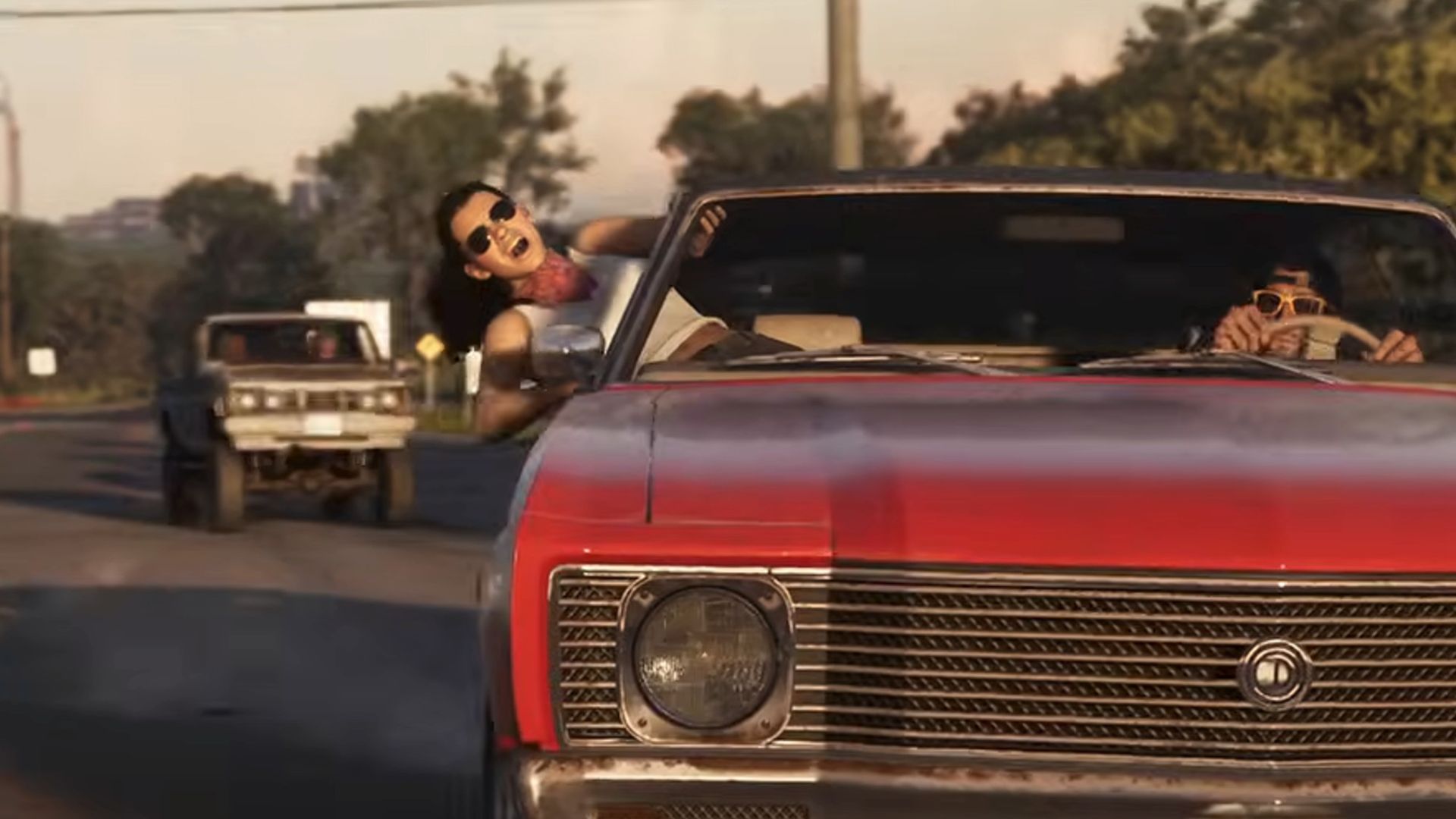 A woman leaning out of a red car's window with a man behind the wheel in Grand Theft Auto VI