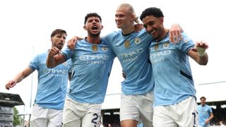 Erling Haaland of Manchester City celebrates scoring his team's second goal from the penalty spot with teammates Ruben Dias, Matheus Nunes and Omar Marmoush during the Premier League match between Fulham FC and Manchester City FC at Craven Cottage on May 25, 2025 in London, England.