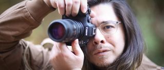 Photographer James Artaius holding the Canon EOS R6 Mark III outdoors