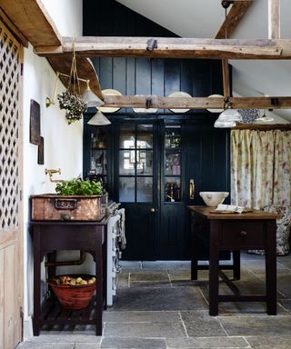 farmhouse kitchen with high beamed ceiling and flagstone floor