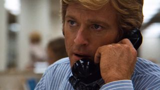 Robert Redford talks on the phone in All the President's Men