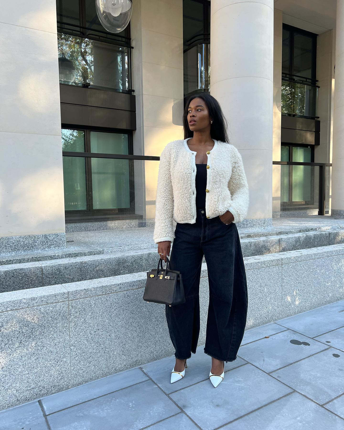 an influencer wearing barrel-leg jeans