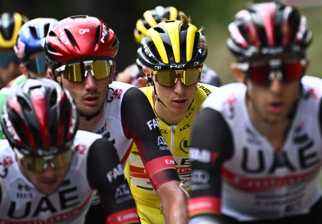 UAE Team Emirates teams Slovenian rider Tadej Pogacar wearing the overall leaders yellow jersey C cycles with his teammates ahead of the pack of riders during the 8th stage of the 109th edition of the of the Tour de France cycling race 1863 km between Dole in eastern France and Lausanne in Switzerland on July 9 2022 Photo by AnneChristine POUJOULAT AFP Photo by ANNECHRISTINE POUJOULATAFP via Getty Images