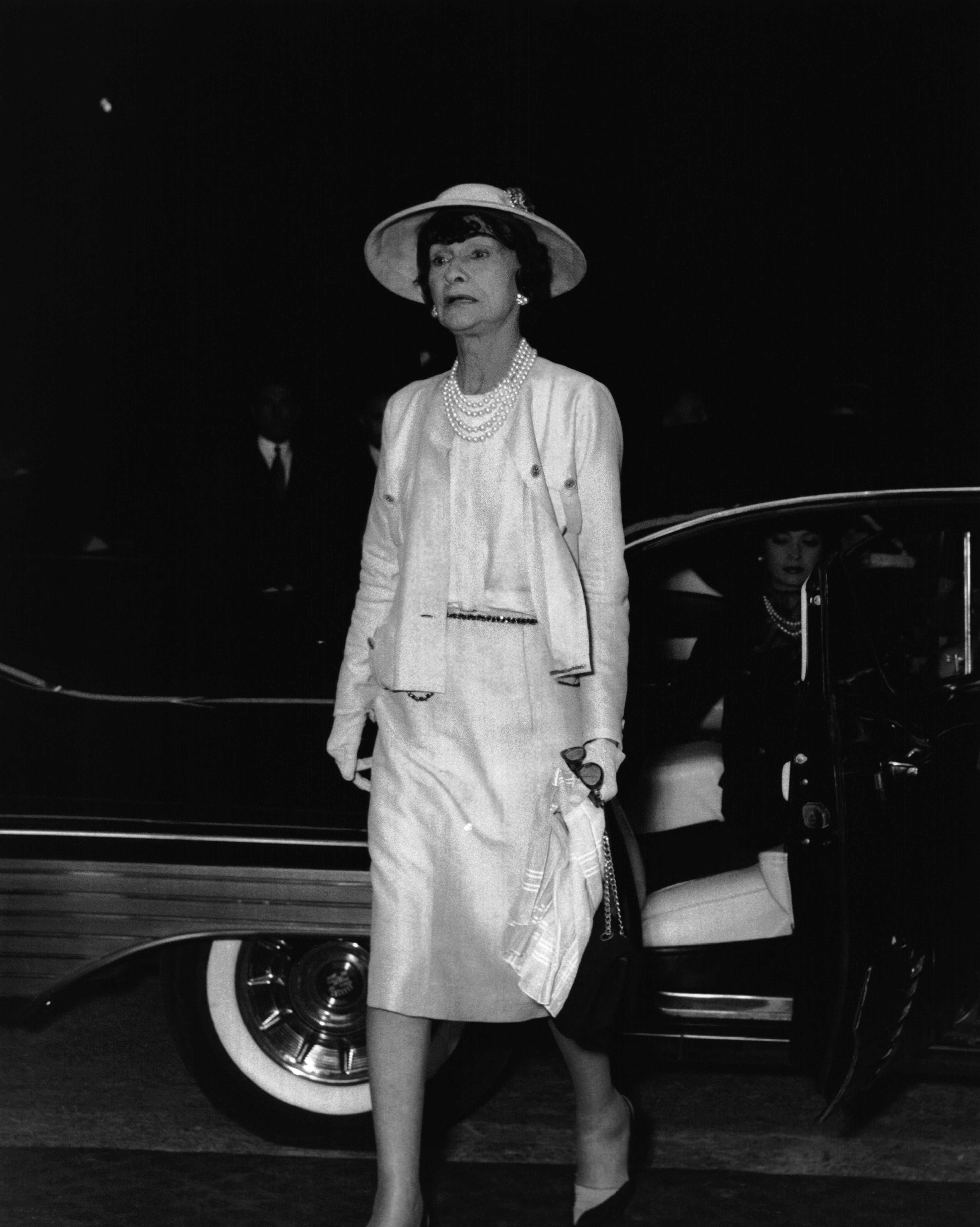 Coco Chanel wears the Chanel 2.55 bag.
