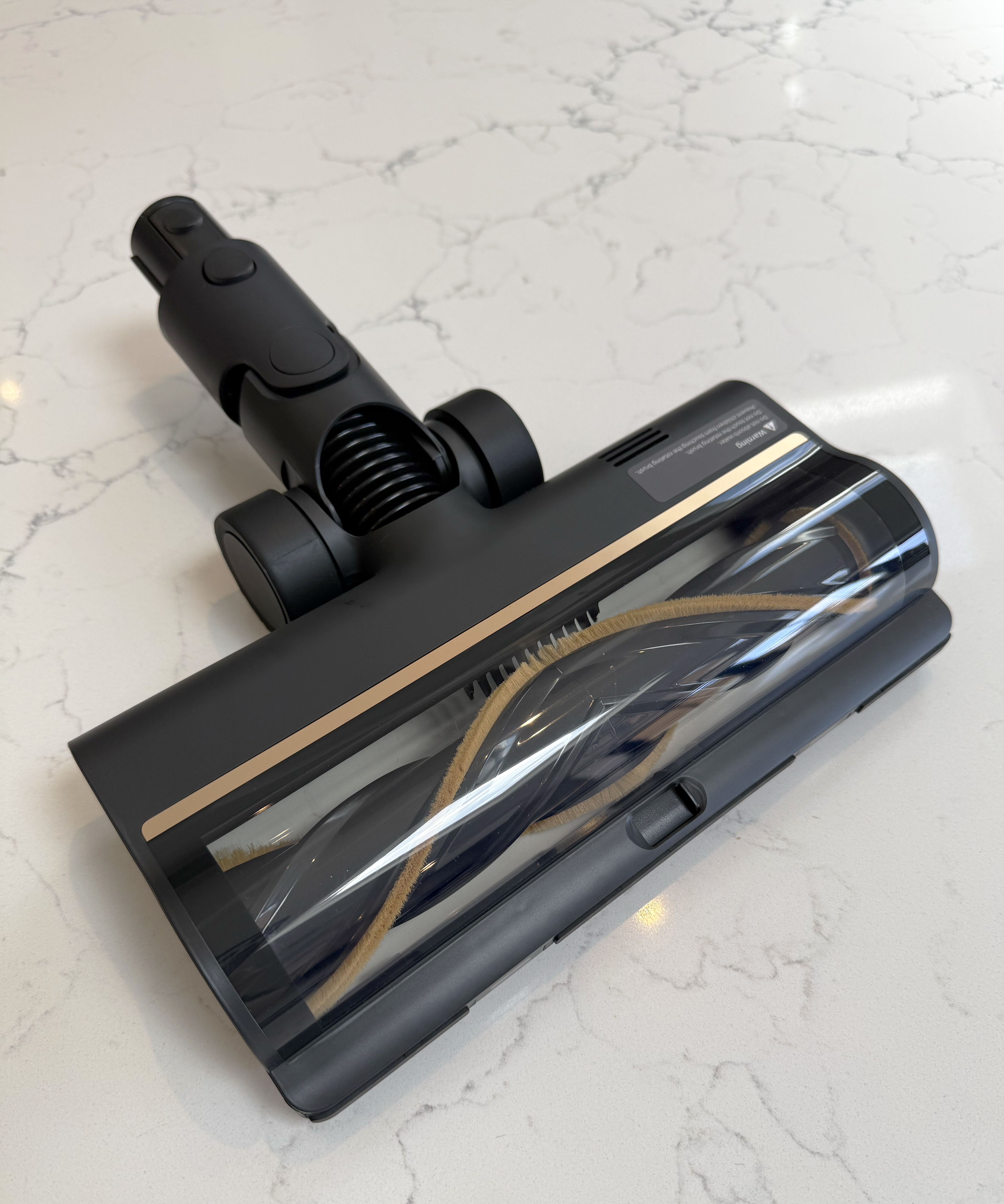 Angled front view of the Dreame R10 Pro multi-surface floorhead with transparent cover