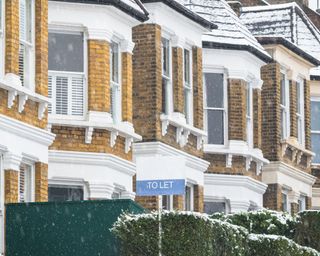 To Let sign during snowfall around Crouch End area in London
