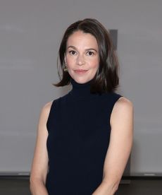 sutton foster on a gray background