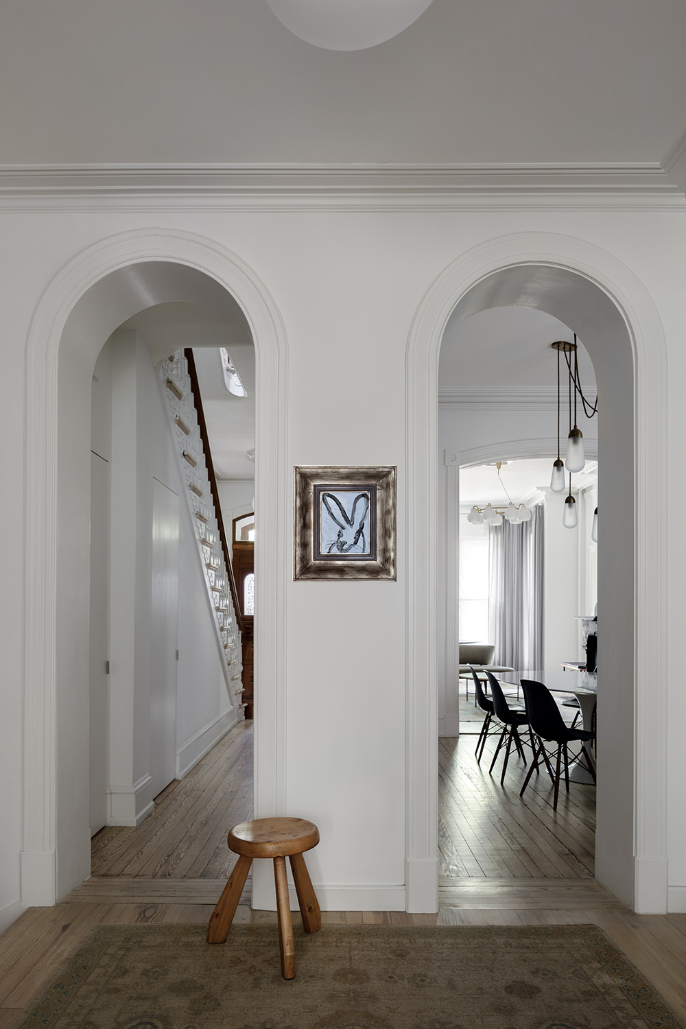 white living room wall with blue art