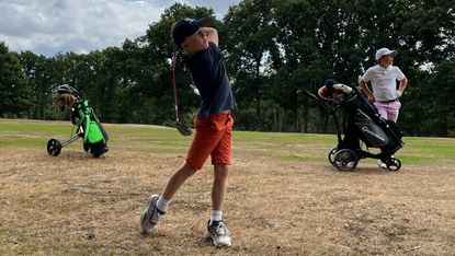 junior golfers on the course