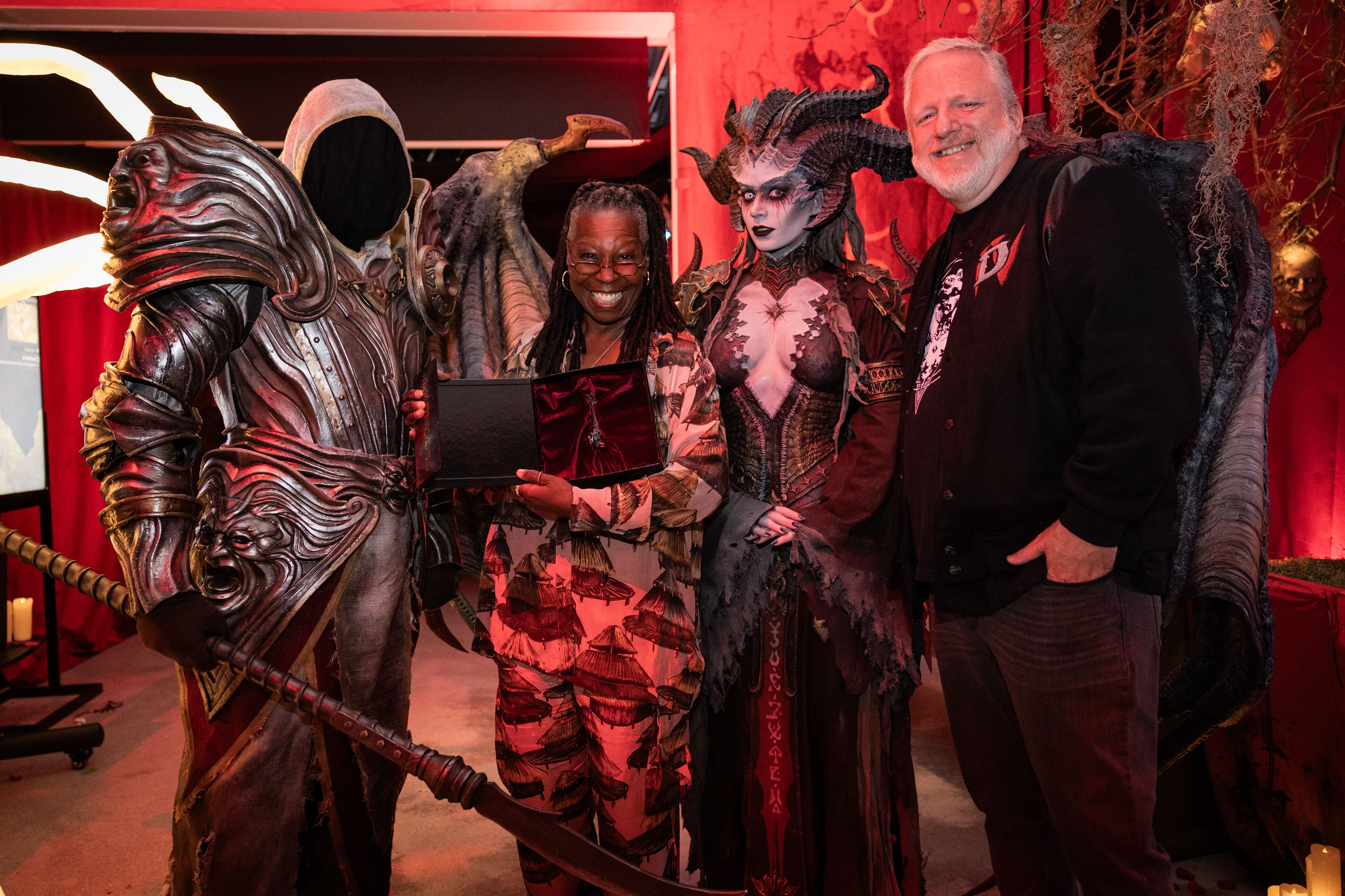 Whoopi Goldberg flanked by Lilith, Inarius, and Diablo general manager Rod Fergusson.