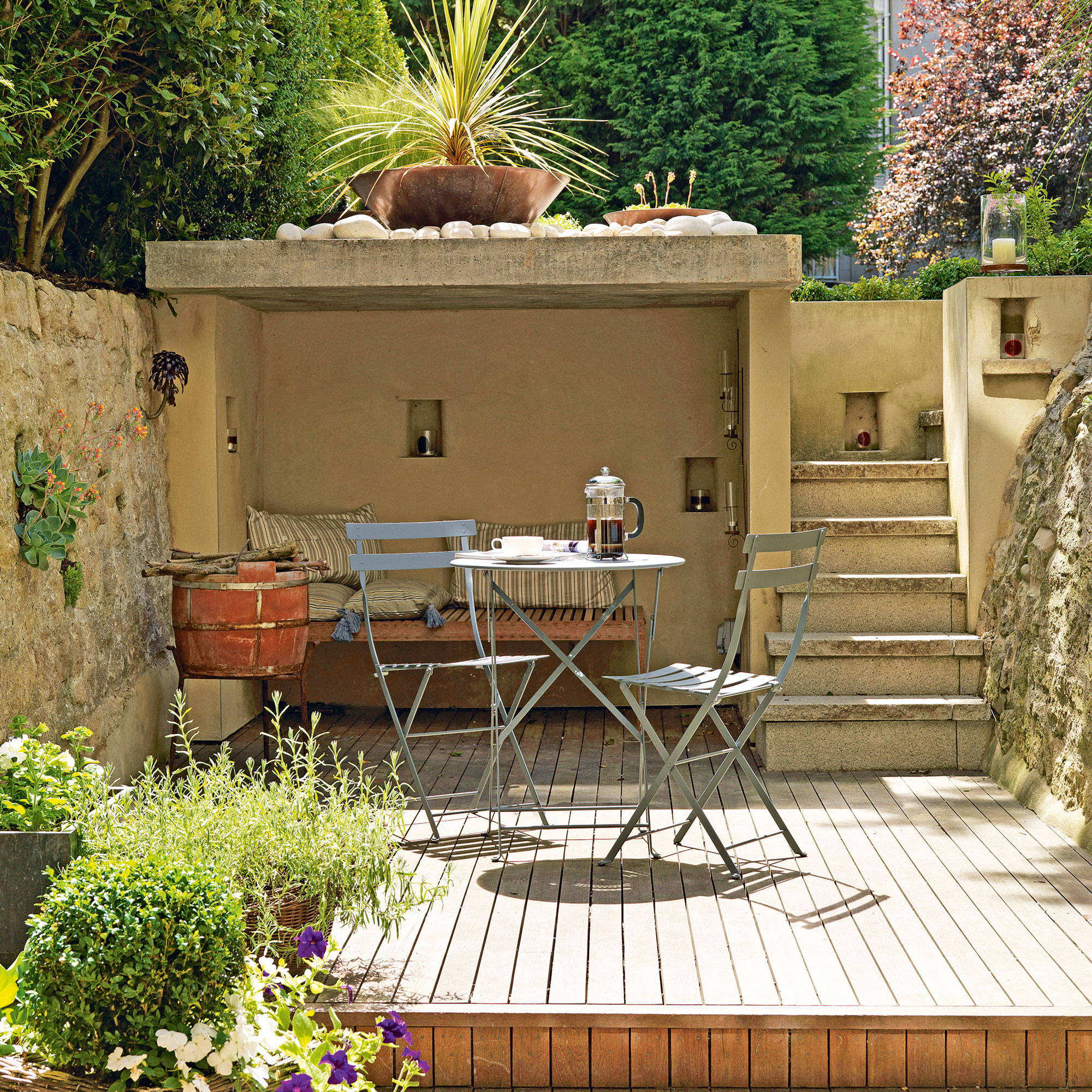 Concrete garden alcove with bistro set