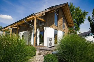 an air source heat pump fitted to the exterior of a self build home