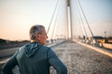 Man at the start of a bridge
