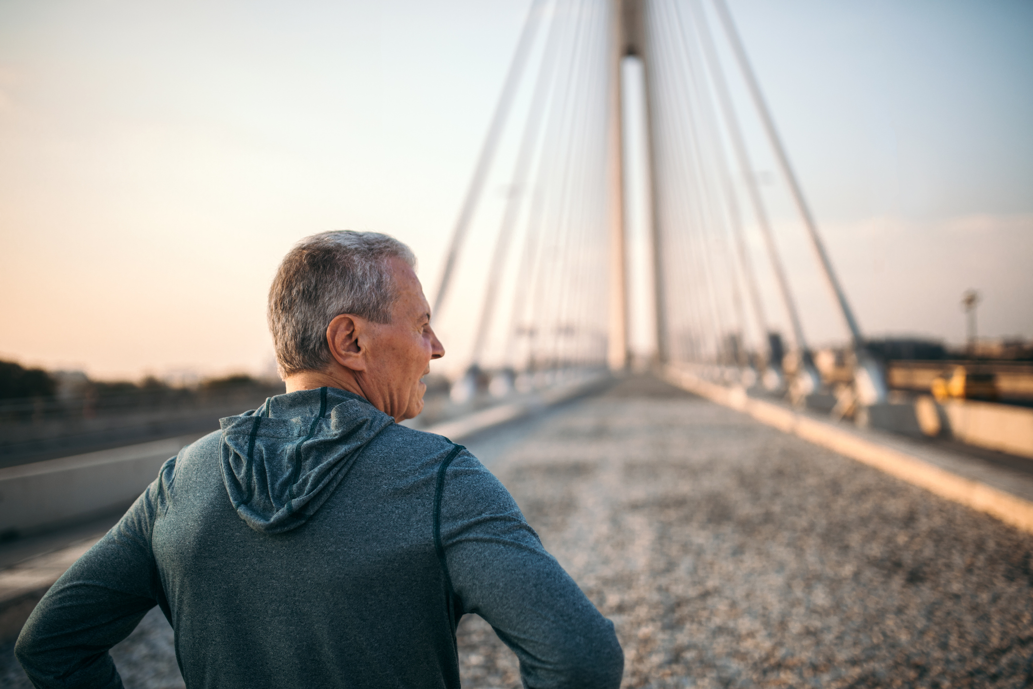 Man at the start of a bridge