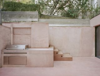 pink house's concrete courtyard at Pigment House by unknown works
