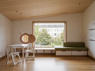 Herzog & de Meuron Children's Hospital in Zurich timber building interior and exterior engulfed in foliage