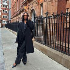 An image of influencer @rochellehumes wearing a footwear style that should make up a 2025 shoe capsule wardrobe.