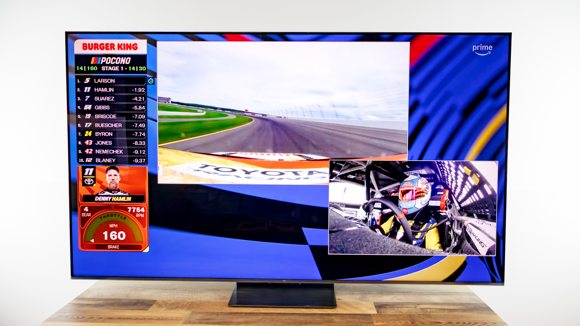 TCL QM7L 75-inch TV on a desk