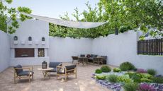 A large patio covered by a shade sail