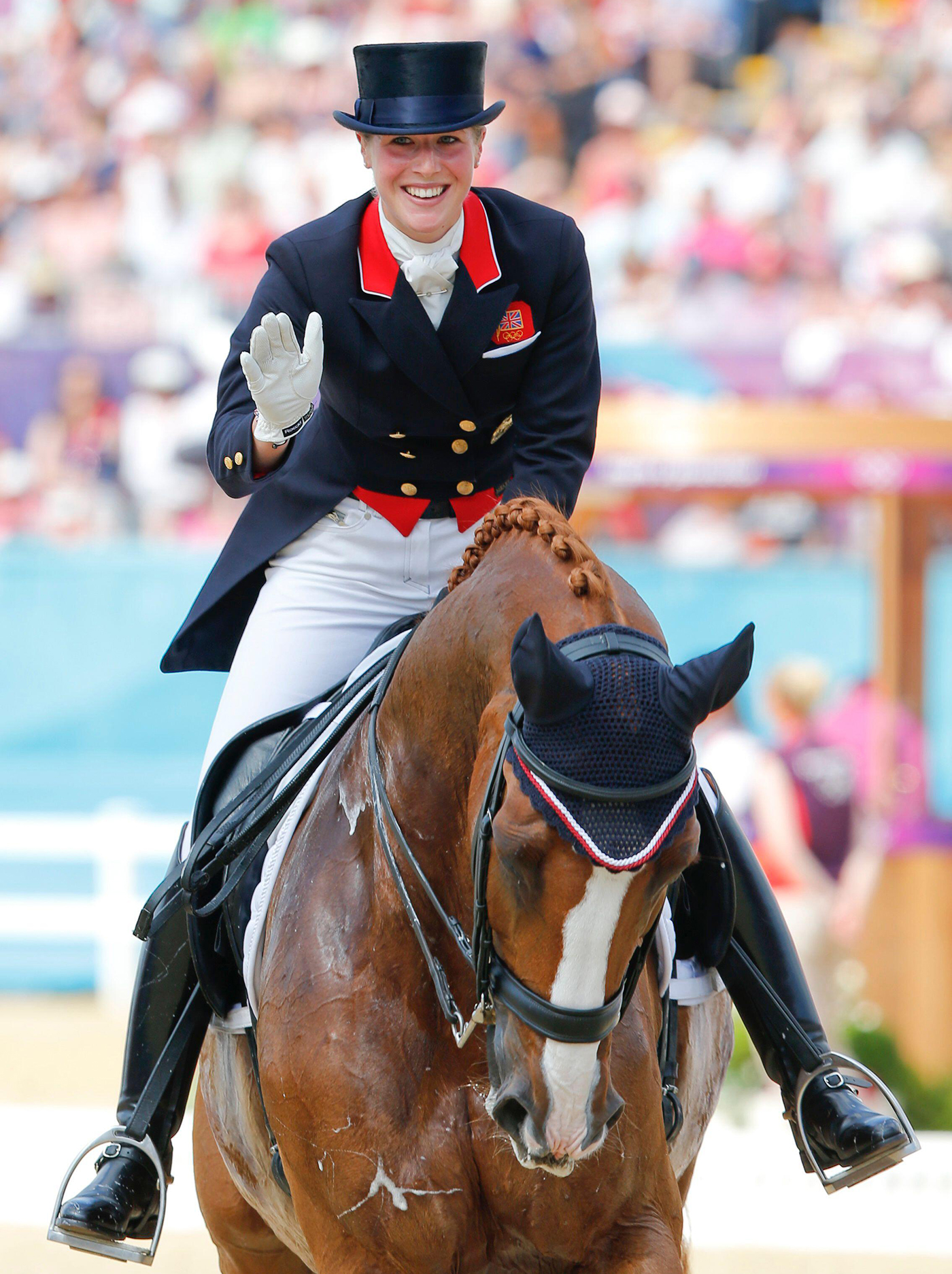 2D0710M Laura Bechtolsheimer of Britain riding Mistral Hojris gestures after the equestrian Dressage Individual Grand Prix Freestyle at the London 2012 Olympic Games in Greenwich Park August 9, 2012. REUTERS/Mike Hutchings (BRITAIN - Tags: SPORT EQUESTRIANISM OLYMPICS)