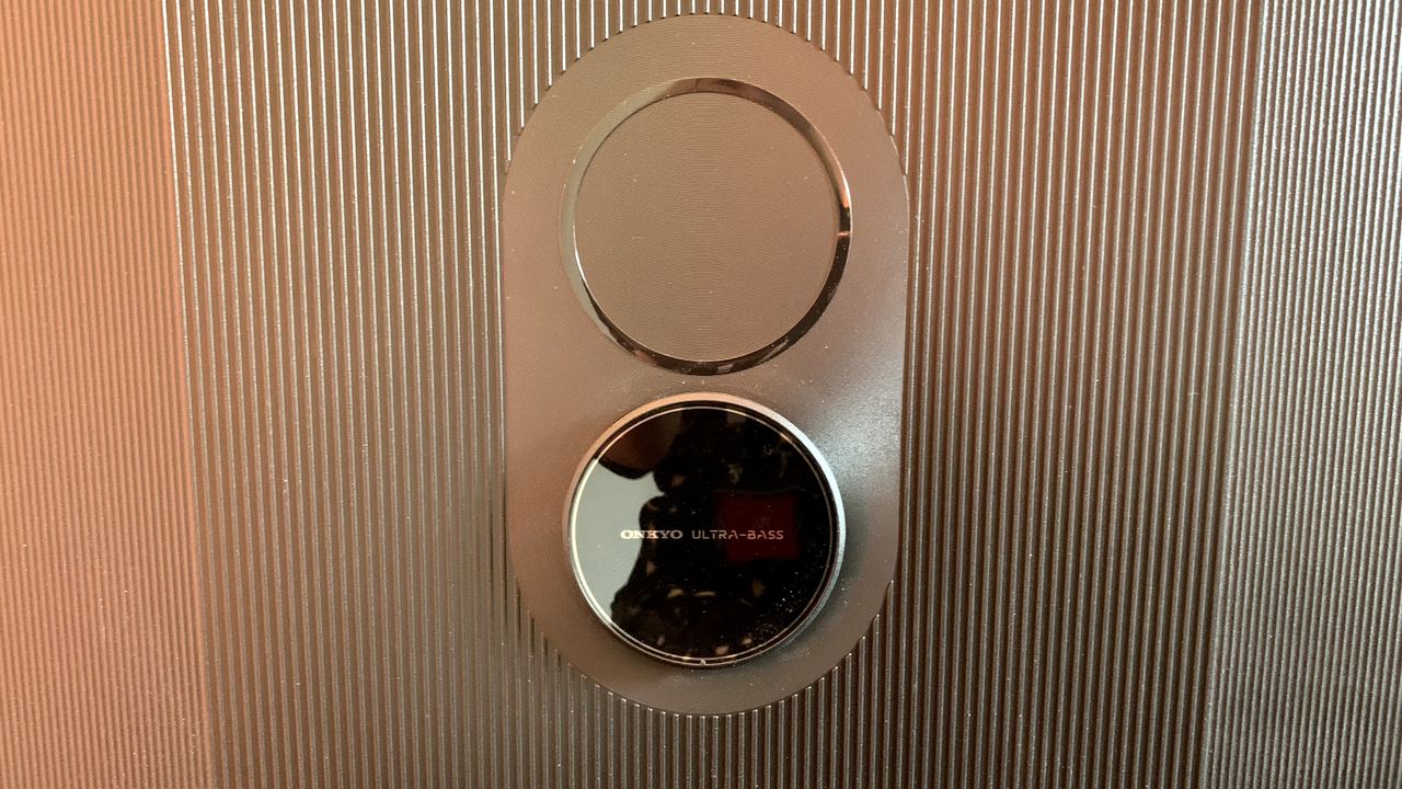 TCL C84 TV detail with Onkyo subwoofer built into the back/base