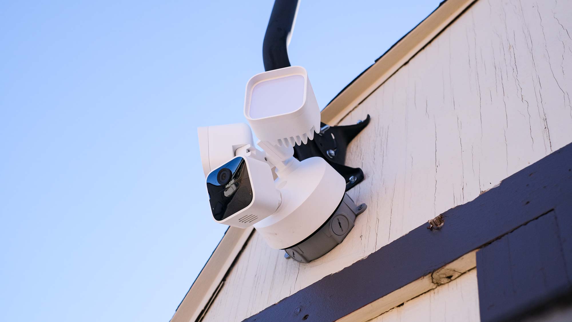 Blink Wired Floodlight Camera attached to side of house