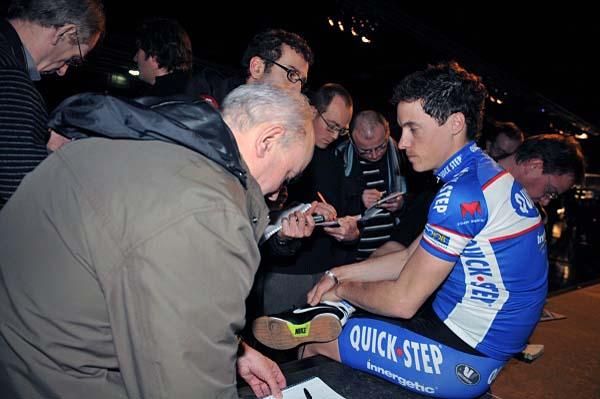 Sylvain Chavanel is swarmed by journalists.