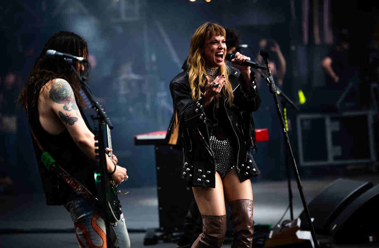 Lzzy Hale performing onstage at the Back To The Beginning show at Villa Park in July 2025