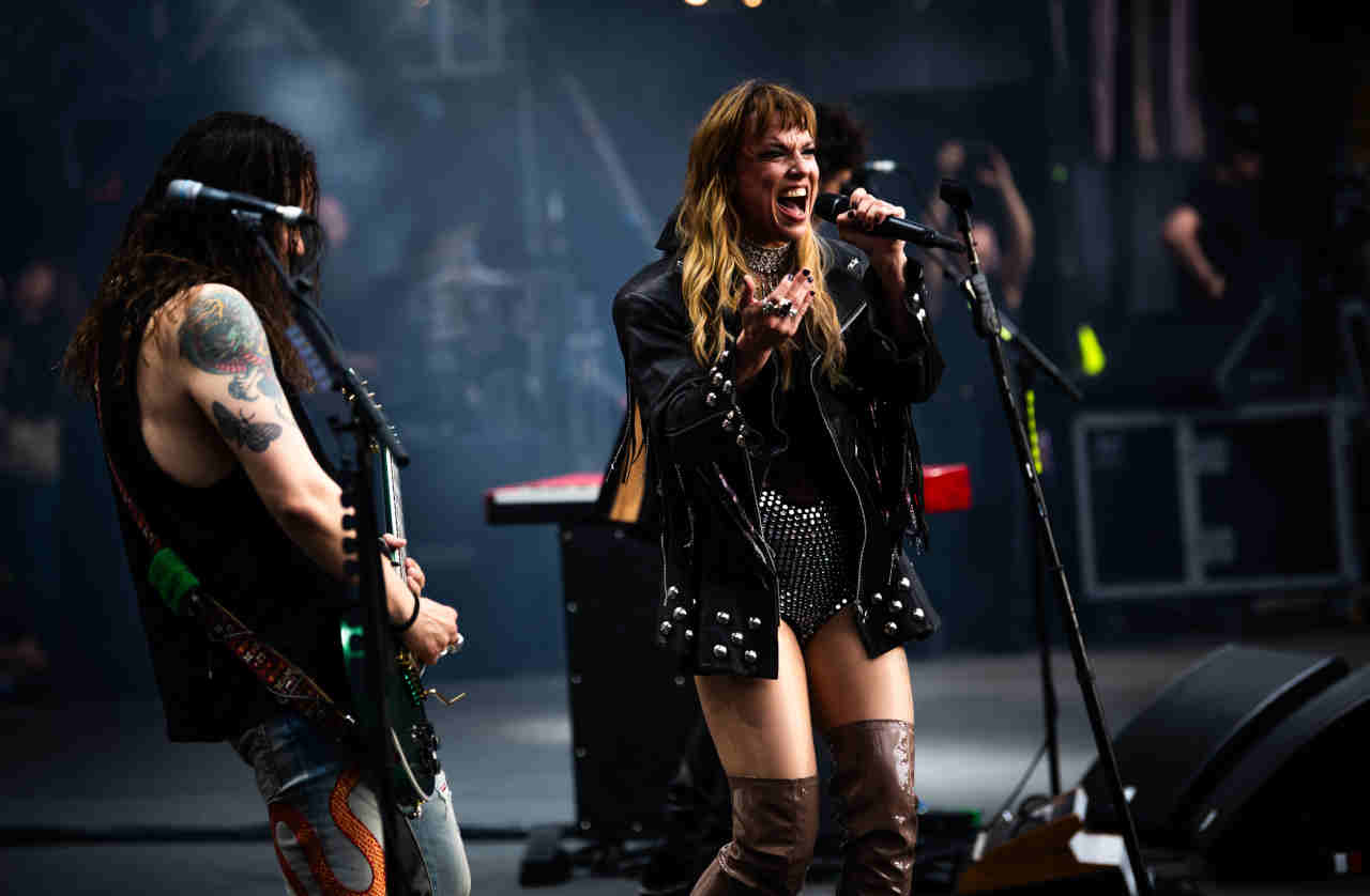 Lzzy Hale performing onstage at the Back To The Beginning show at Villa Park in July 2025