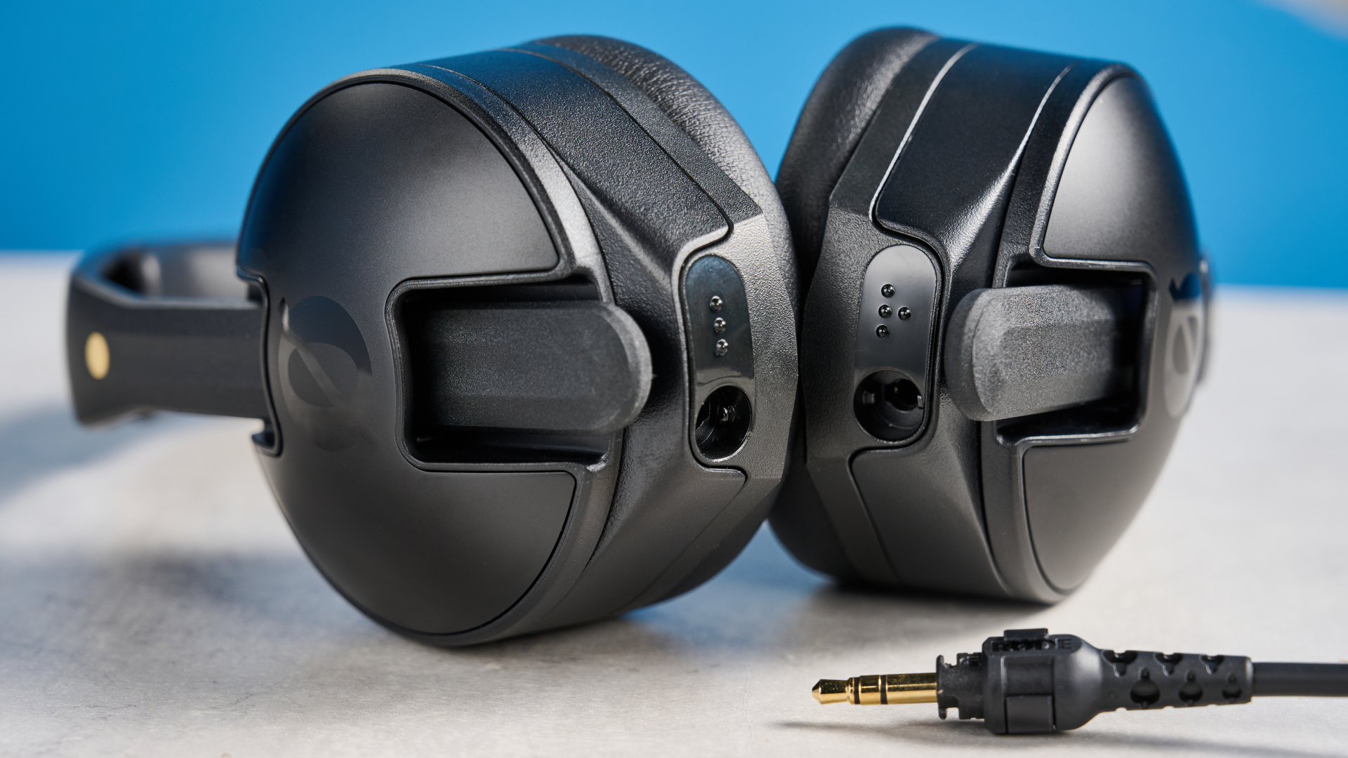 the rode nth-50 studio headphones in black showing the long cable, 3.5mm jack, 1/4 jack, and in use
